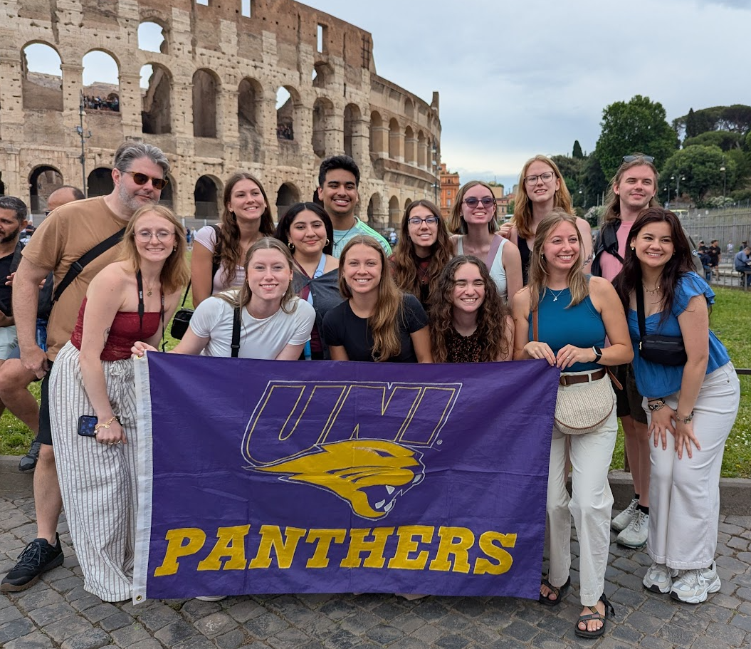 Student group holding a UNI flag in Italy