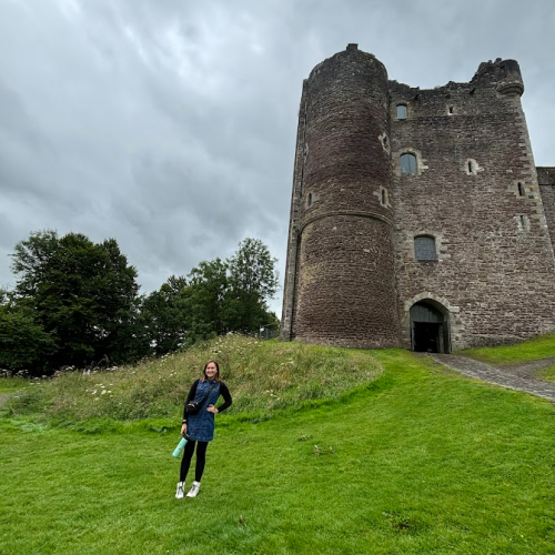 student in front of the castle 